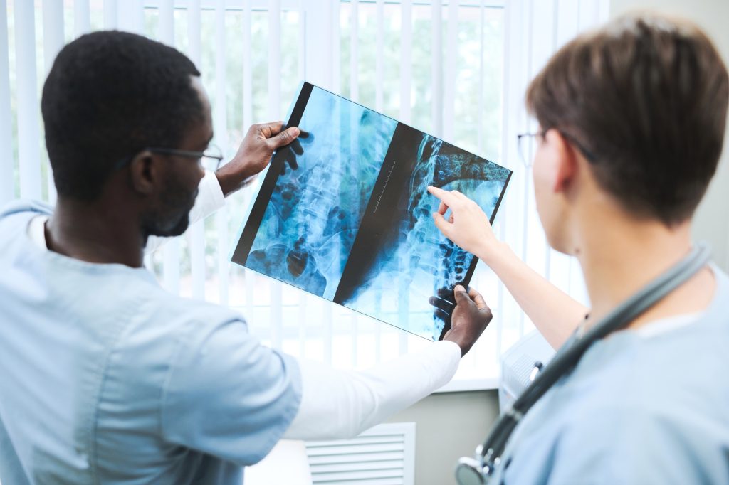 Discussing x-ray image with colleague