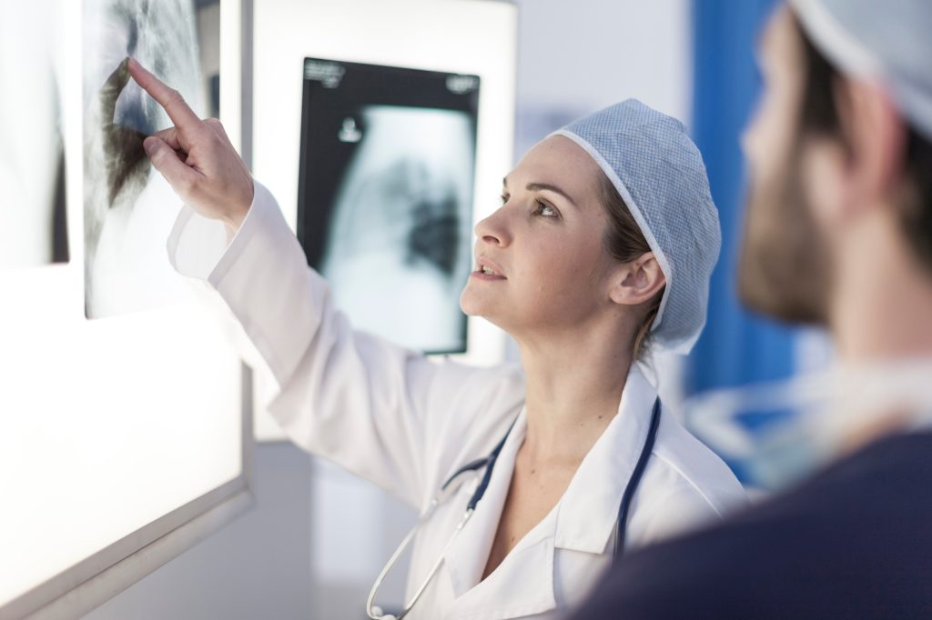 Doctor in hospital, radiologists discussing